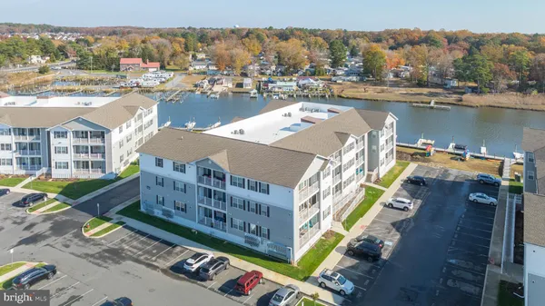 an aerial view of a house with a lake view