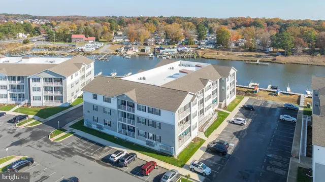 an aerial view of a house with a lake view