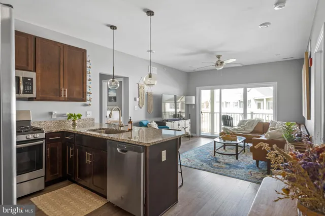 a kitchen with a sink stove and microwave