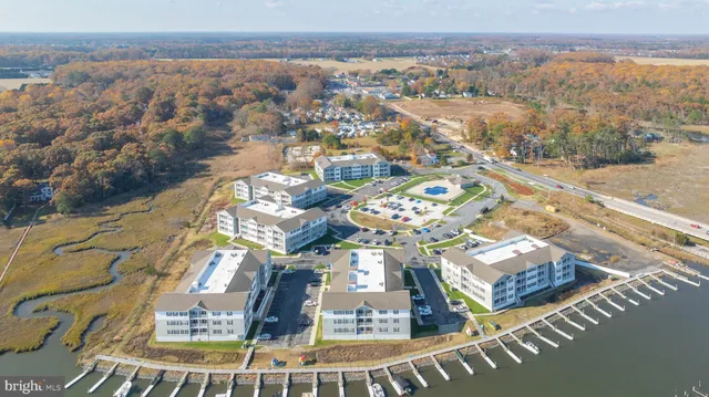 an aerial view of a house with a lake view