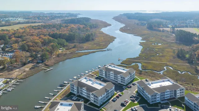 an aerial view of a house with a lake view