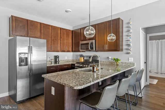 a kitchen with a sink stove and microwave