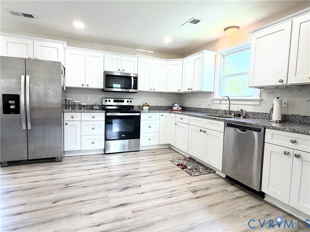 7547 Media Park Road Henrico, VA 23231 - Photo 5 of 21 Kitchen featuring white cabinetry, stainless steel