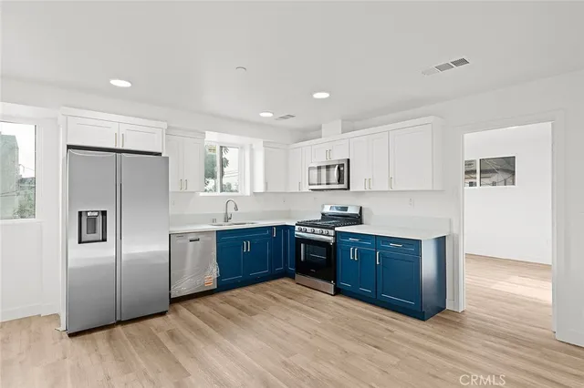 a bathroom with a glass shower door