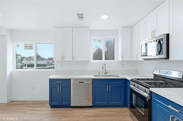 a view of staircase with white walls and windows