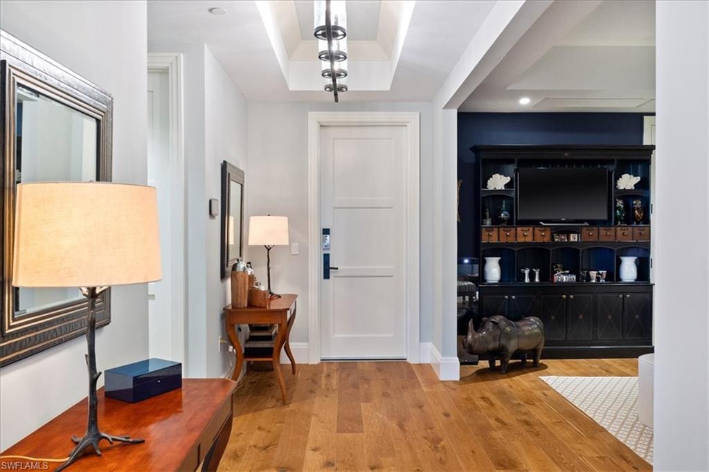 1035 3rd Avenue South, Unit 401 Naples, FL 34102 - Photo 2 of 43 a view of a livingroom with furniture and closet