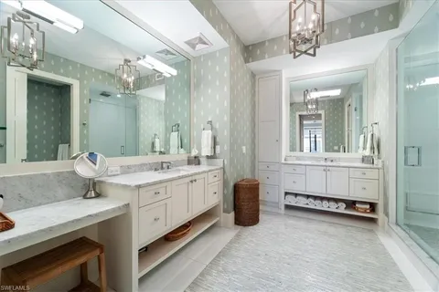 a bathroom with a granite countertop sink a mirror and a