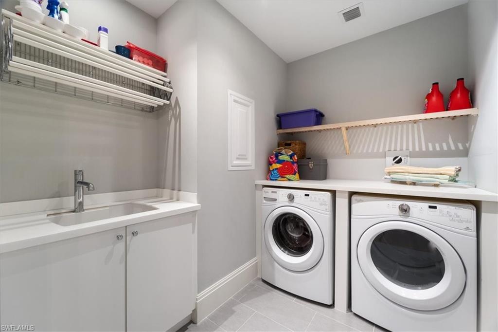1035 3rd Avenue South, Unit 401 Naples, FL 34102 - Photo 28 of 43 a utility room with dryer and washer