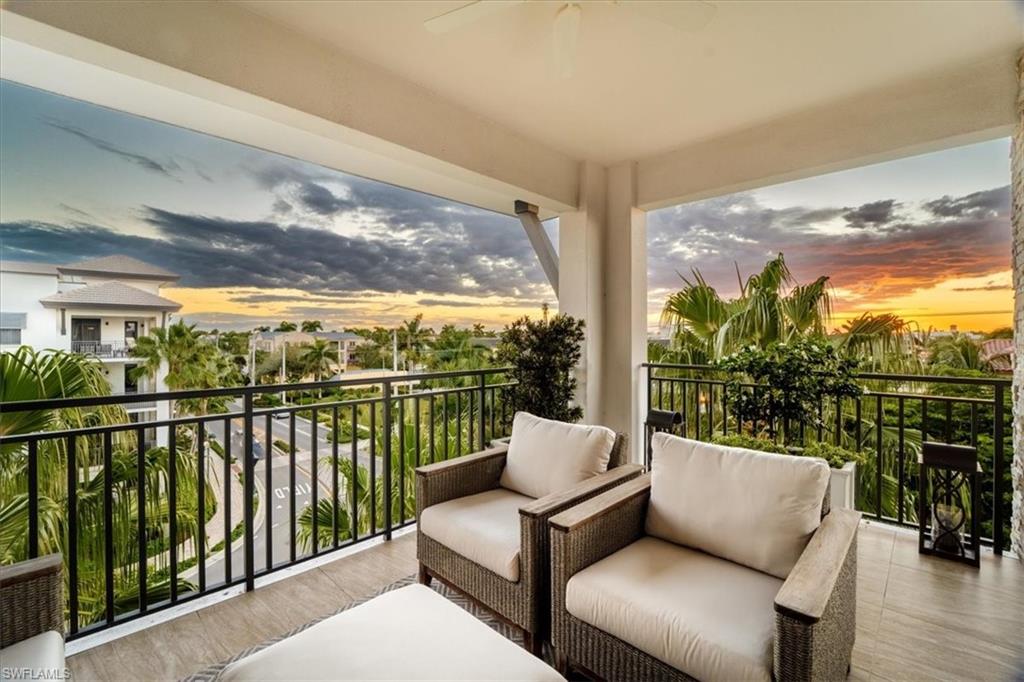 1035 3rd Avenue South, Unit 401 Naples, FL 34102 - Photo 34 of 43 a balcony with furniture and city view