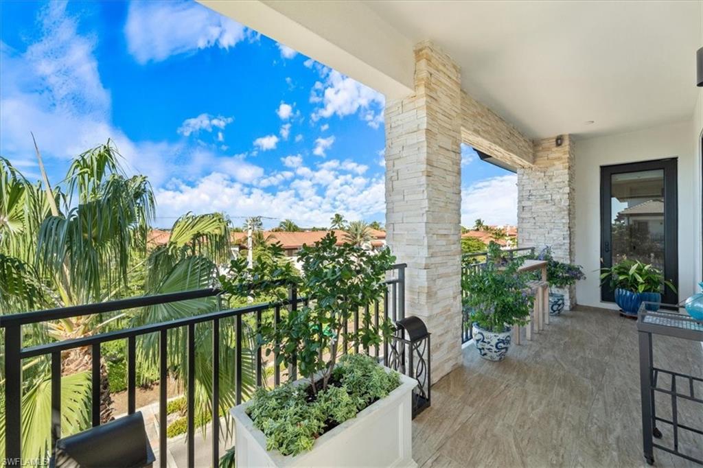 1035 3rd Avenue South, Unit 401 Naples, FL 34102 - Photo 36 of 43 a view of a potted plants from a balcony