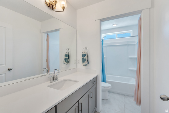 646 South Meade Street Mapleton, UT 84664 - Photo 18 of 46 Bathroom featuring a spacious vanity with an integrated sink, polished chrome faucet, and gray cabinetry