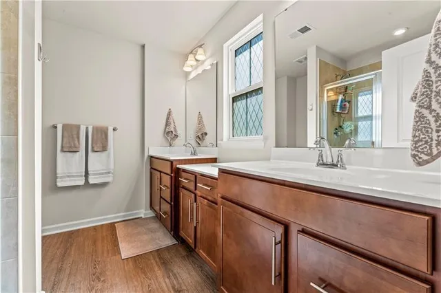 a spacious bathroom with stainless steel appliances a sink and a window