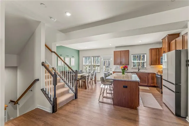 a room with lots of furniture and a wooden floor