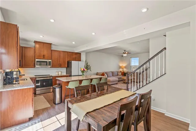 a large kitchen with a table and chairs