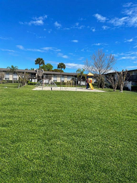 1695 Lee Road, Unit C206 Winter Park, FL 32789 - Photo 16 of 18 a view of a golf course with a building in the background