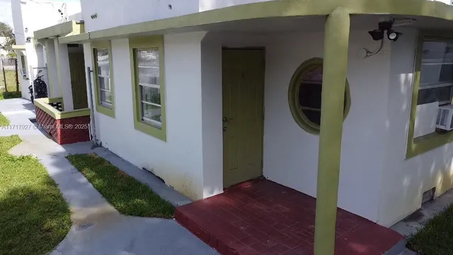 an aerial view of a house with outdoor space