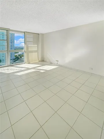 a view of a livingroom and window