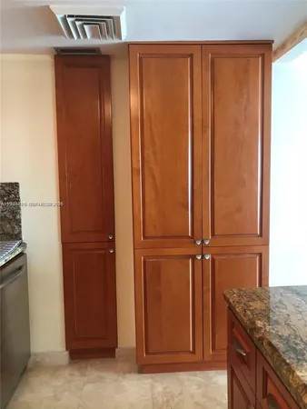 a view of a kitchen with a refrigerator