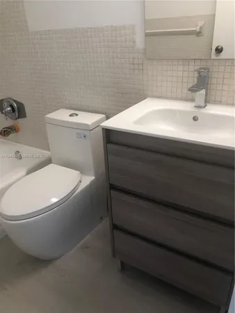 a bathroom with a sink and a toilet