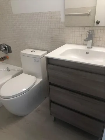 a bathroom with a sink and a toilet
