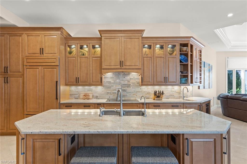 6963 Verde Way Naples, FL 34108 - Photo 11 of 31 a kitchen with a table and chairs