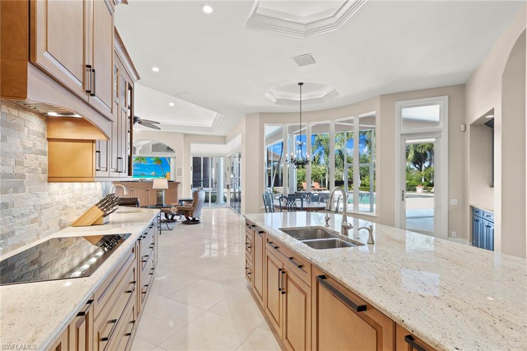 6963 Verde Way Naples, FL 34108 - Photo 12 of 31 a large kitchen with stainless steel appliances lots of counter space and a sink