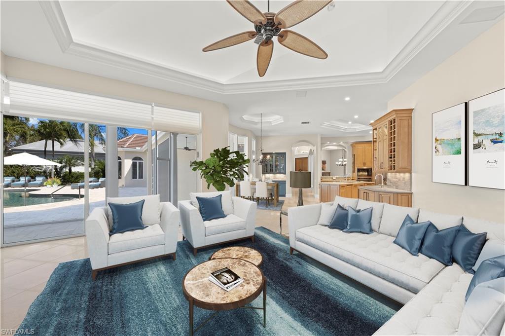 6963 Verde Way Naples, FL 34108 - Photo 14 of 31 a living room with furniture and a large window