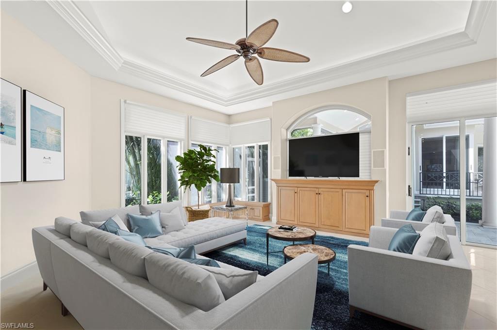 6963 Verde Way Naples, FL 34108 - Photo 15 of 31 a living room with furniture and a flat screen tv
