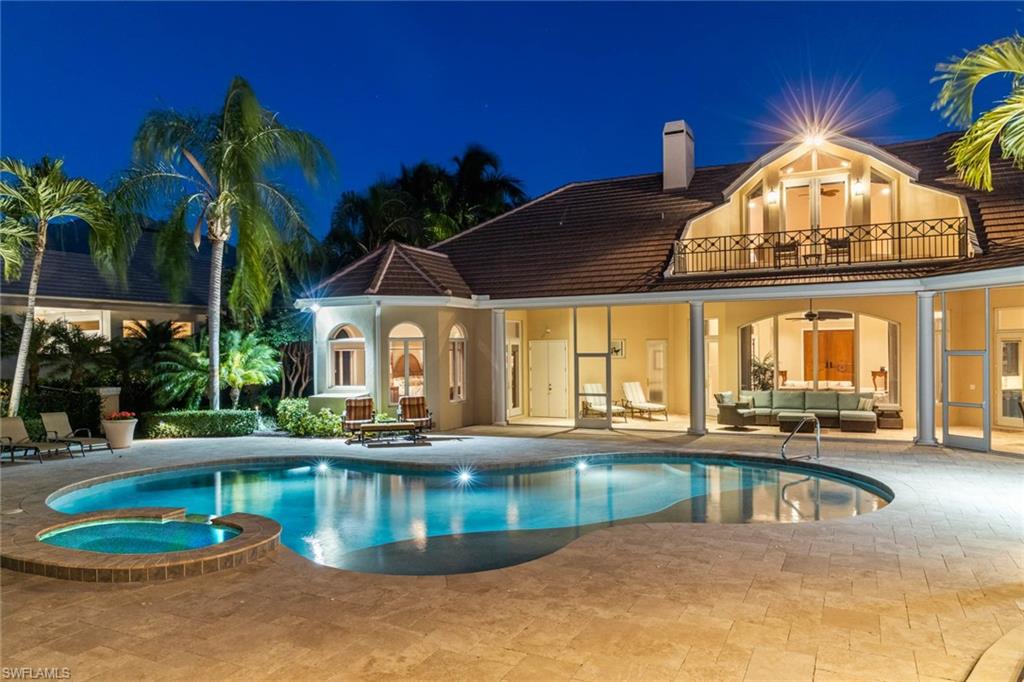6963 Verde Way Naples, FL 34108 - Photo 27 of 31 a view of a house with swimming pool and sitting area