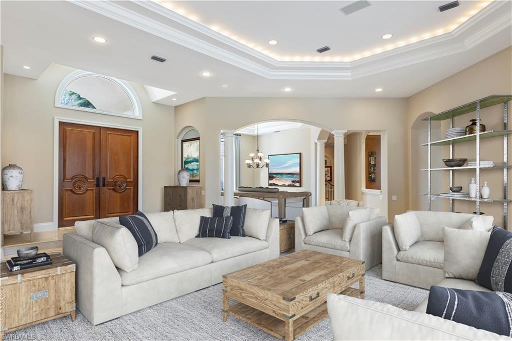 6963 Verde Way Naples, FL 34108 - Photo 5 of 31 a living room with furniture and a large window