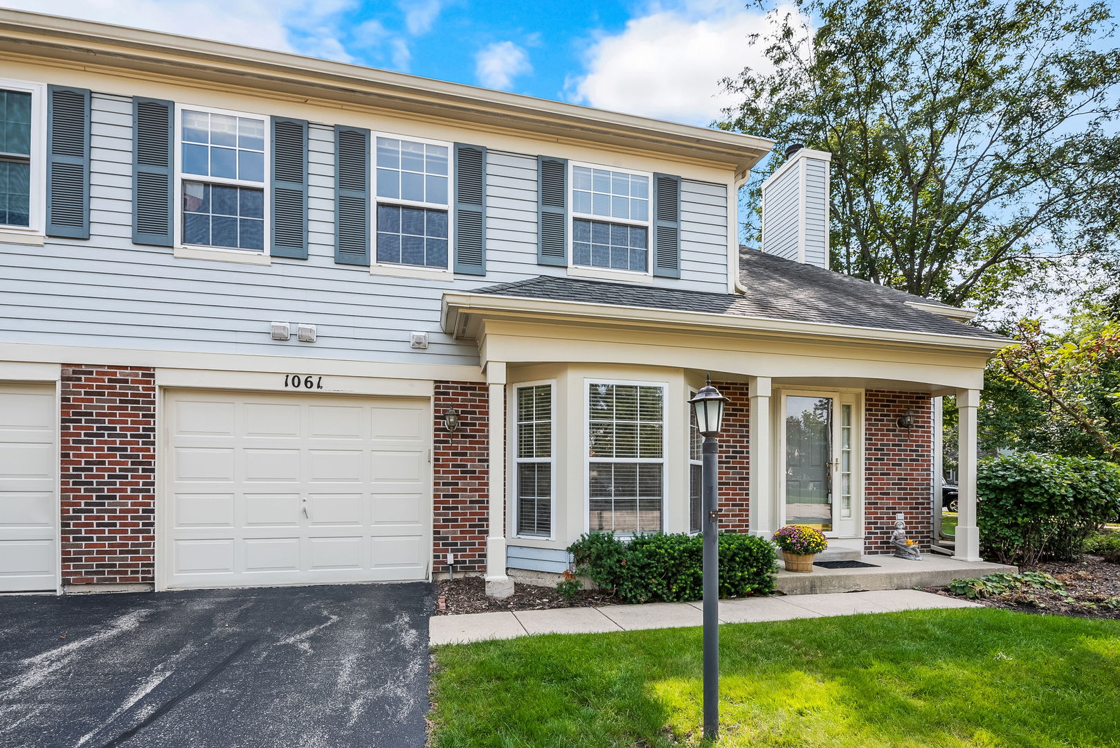 1061 Stillwater Road Elgin, IL 60120 - Photo 1 of 20 a view of a house with a yard and plants