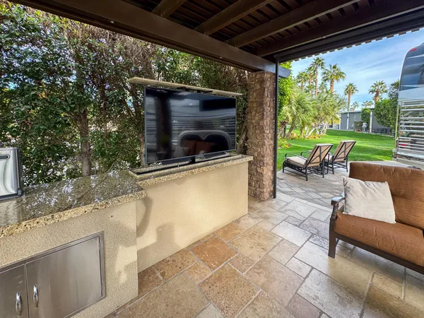 a stove top oven sitting inside of a kitchen