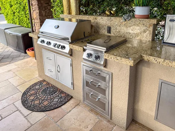 a kitchen with a sink and a stove