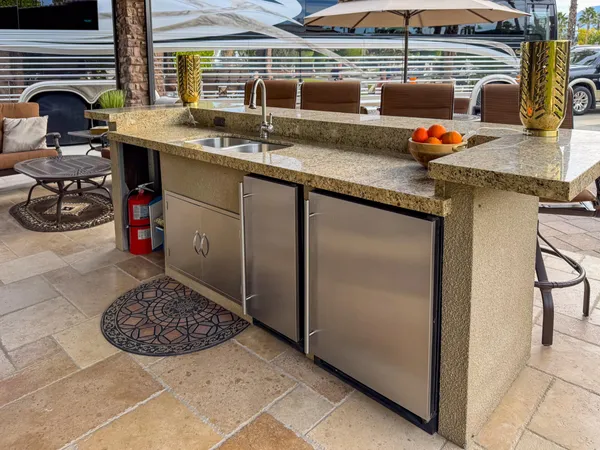 a view of an outdoor sitting space with furniture