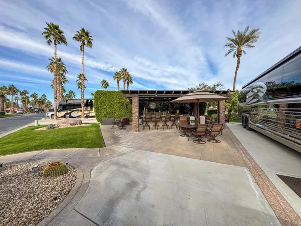 a view of yard with patio