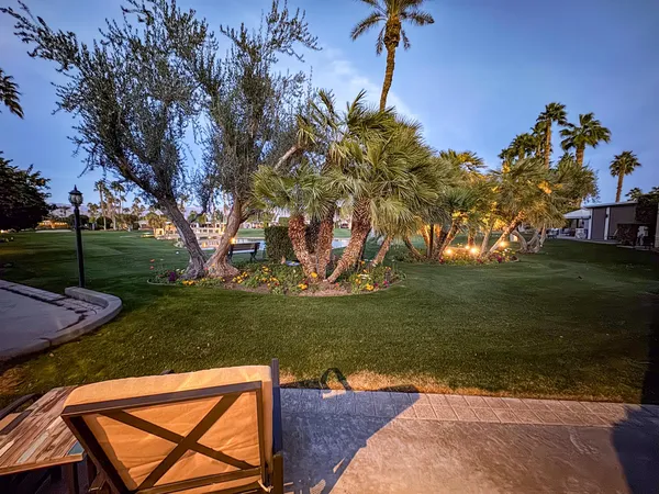 a view of a table and chairs in the patio