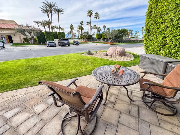 a kitchen with furniture and a clock