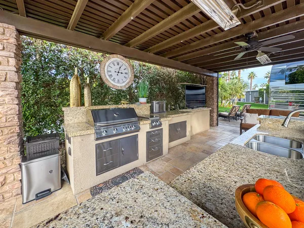 a view of a chairs and table in a patio