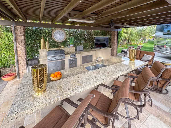 a view of a chairs and table in patio