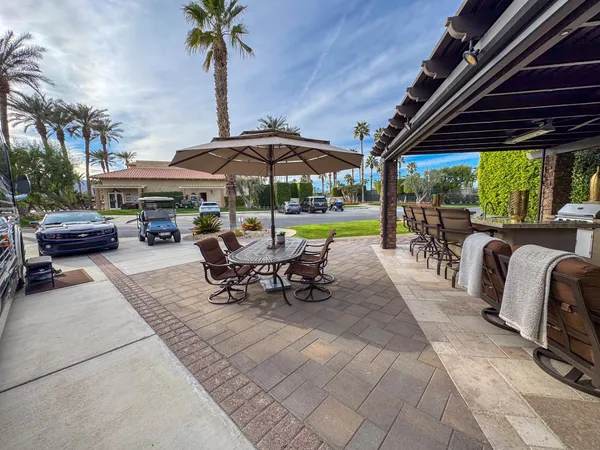 a outdoor dining space with furniture