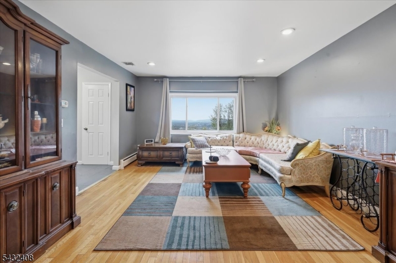 112 Knob Hill Road Hackettstown, NJ 07840 - Photo 5 of 32 a living room with furniture and a rug