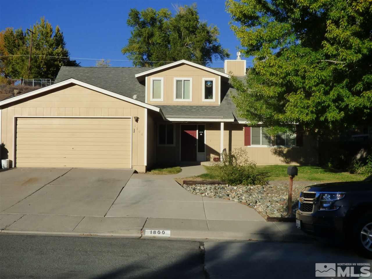 1800 Severn Drive Reno, NV 89503 - Photo 1 of 21 a front view of a house with a yard