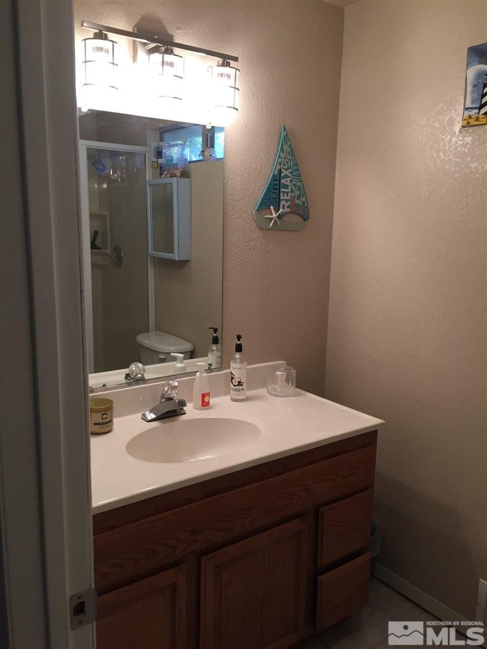 1800 Severn Drive Reno, NV 89503 - Photo 15 of 21 a bathroom with a sink and a mirror
