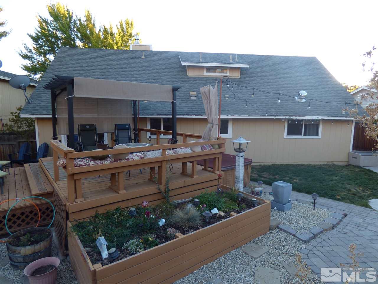 1800 Severn Drive Reno, NV 89503 - Photo 21 of 21 a view of a chairs and table in the back yard of the house