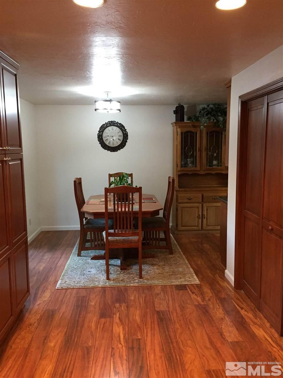 1800 Severn Drive Reno, NV 89503 - Photo 4 of 21 a view of a dining room with furniture and wooden floor