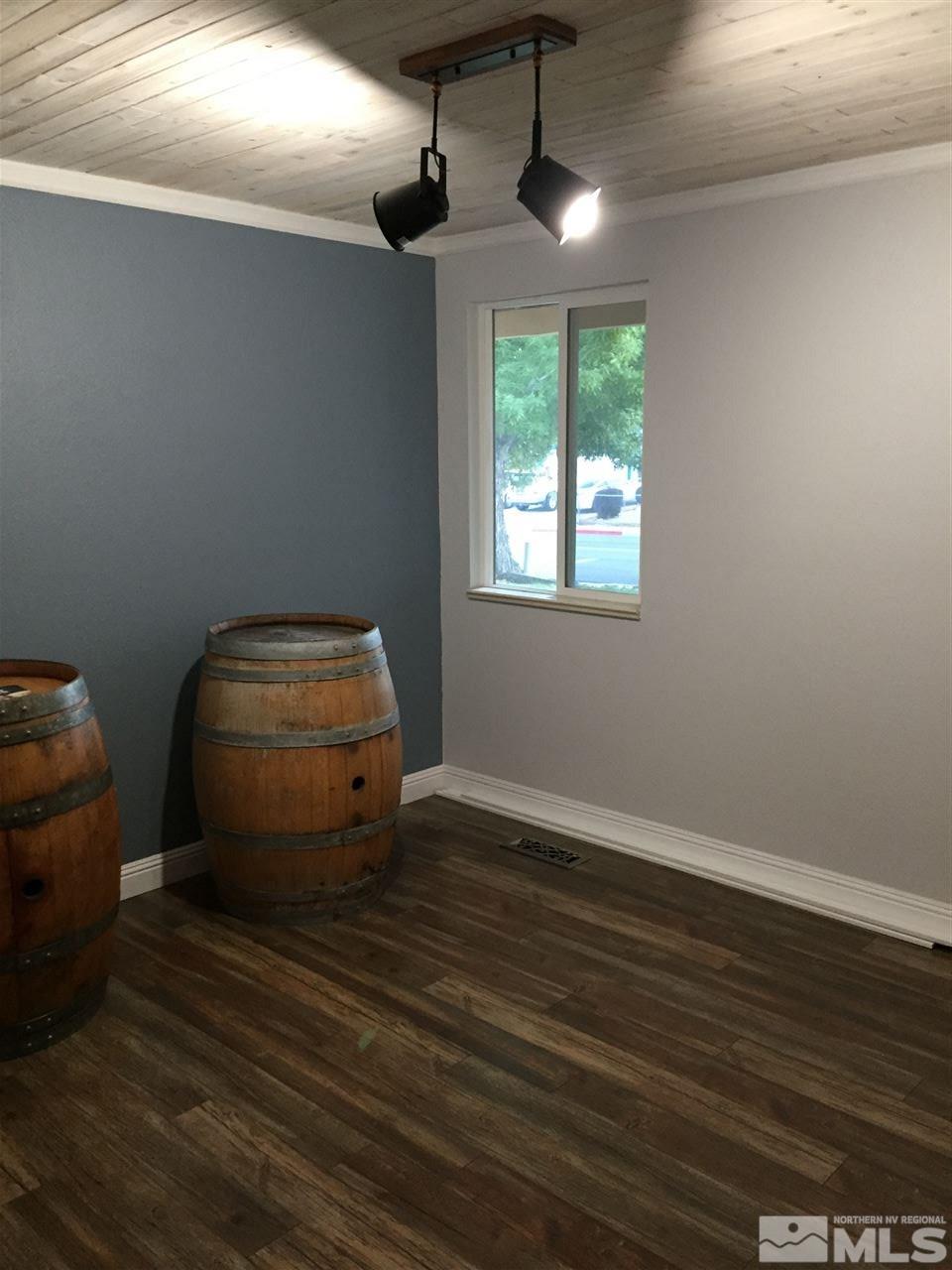 1800 Severn Drive Reno, NV 89503 - Photo 7 of 21 a room with wooden floor and chandelier