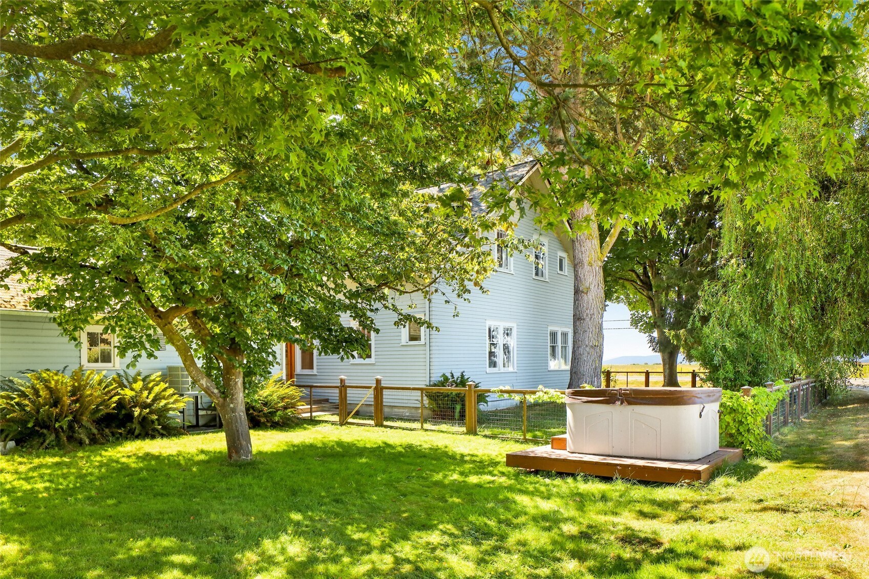 4749 Chuckanut Mountain Drive Bow, WA 98232 - Photo 11 of 40 a front view of a house with a yard and trees