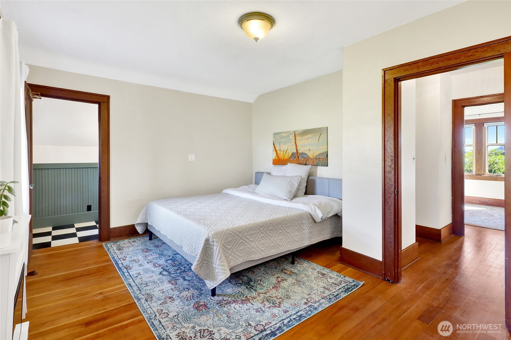 4749 Chuckanut Mountain Drive Bow, WA 98232 - Photo 15 of 40 a bedroom with a bed and wooden floor