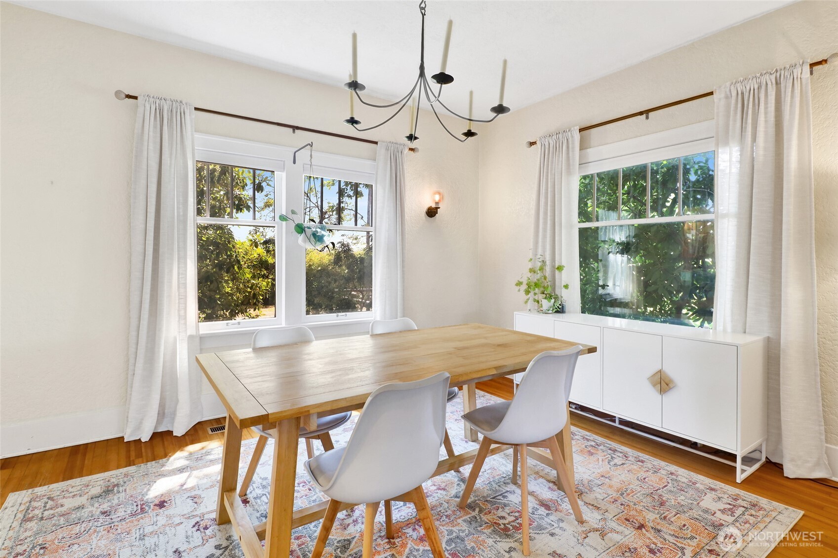 4749 Chuckanut Mountain Drive Bow, WA 98232 - Photo 22 of 40 a view of a dining room with furniture window and wooden floor