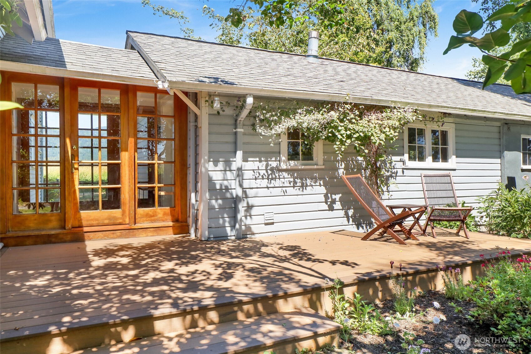 4749 Chuckanut Mountain Drive Bow, WA 98232 - Photo 24 of 40 a front view of a house with a garden